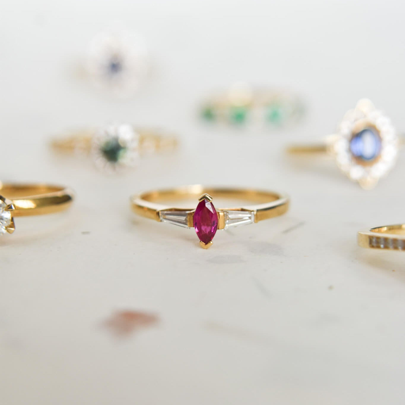 CHERRY gold ring with a marquise-cut ruby ​​and trapezoid-cut diamonds