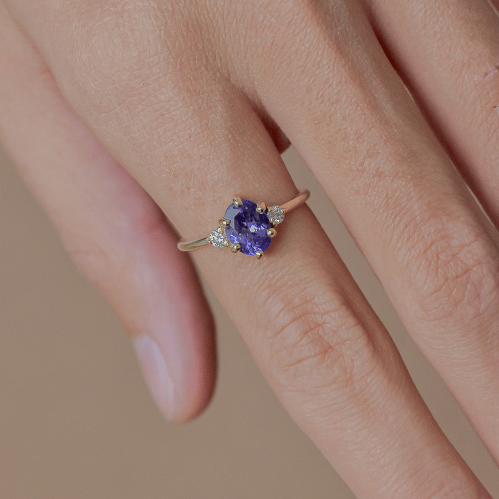 ROSA gold ring with oval purple tanzanite and diamonds