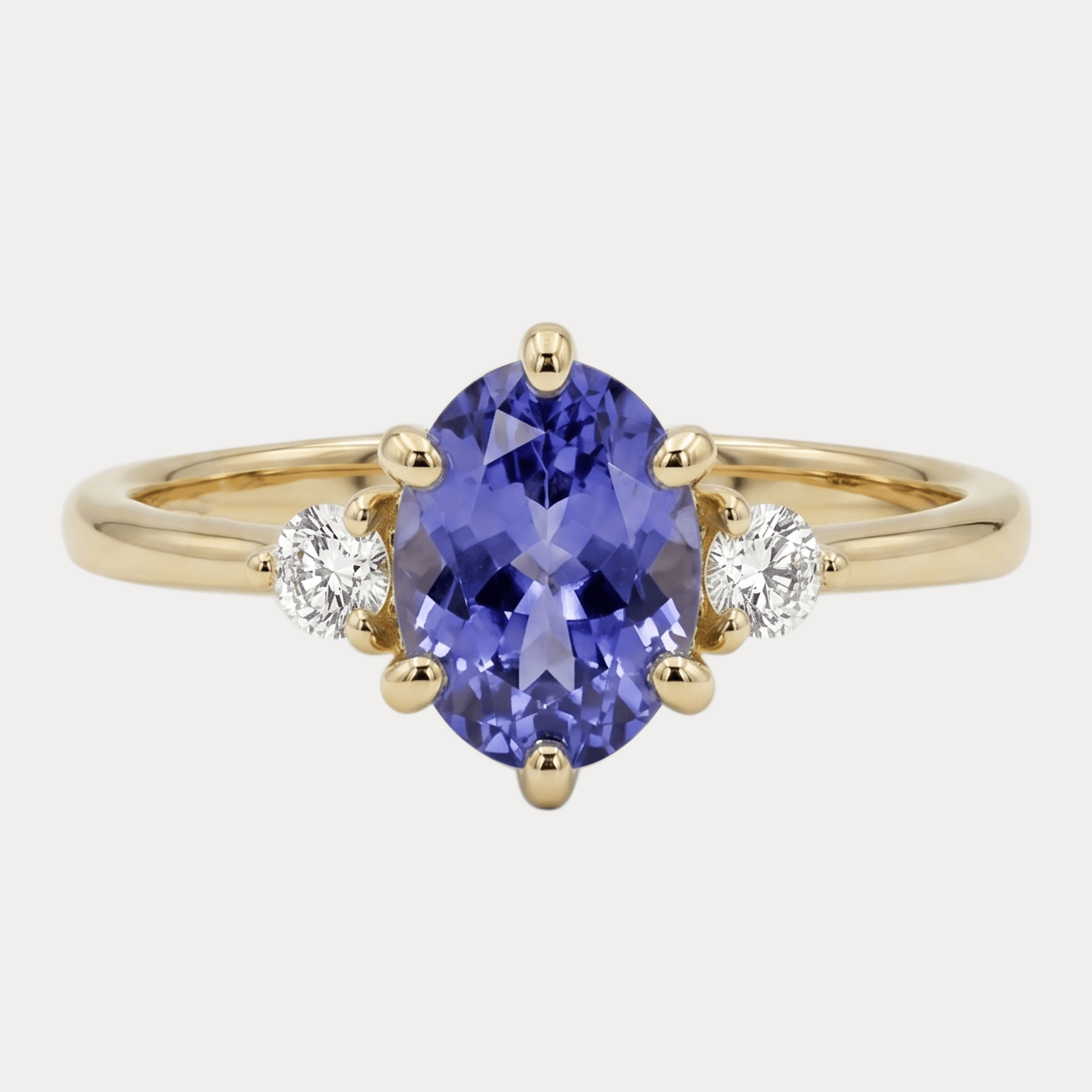 ROSA gold ring with oval purple tanzanite and diamonds
