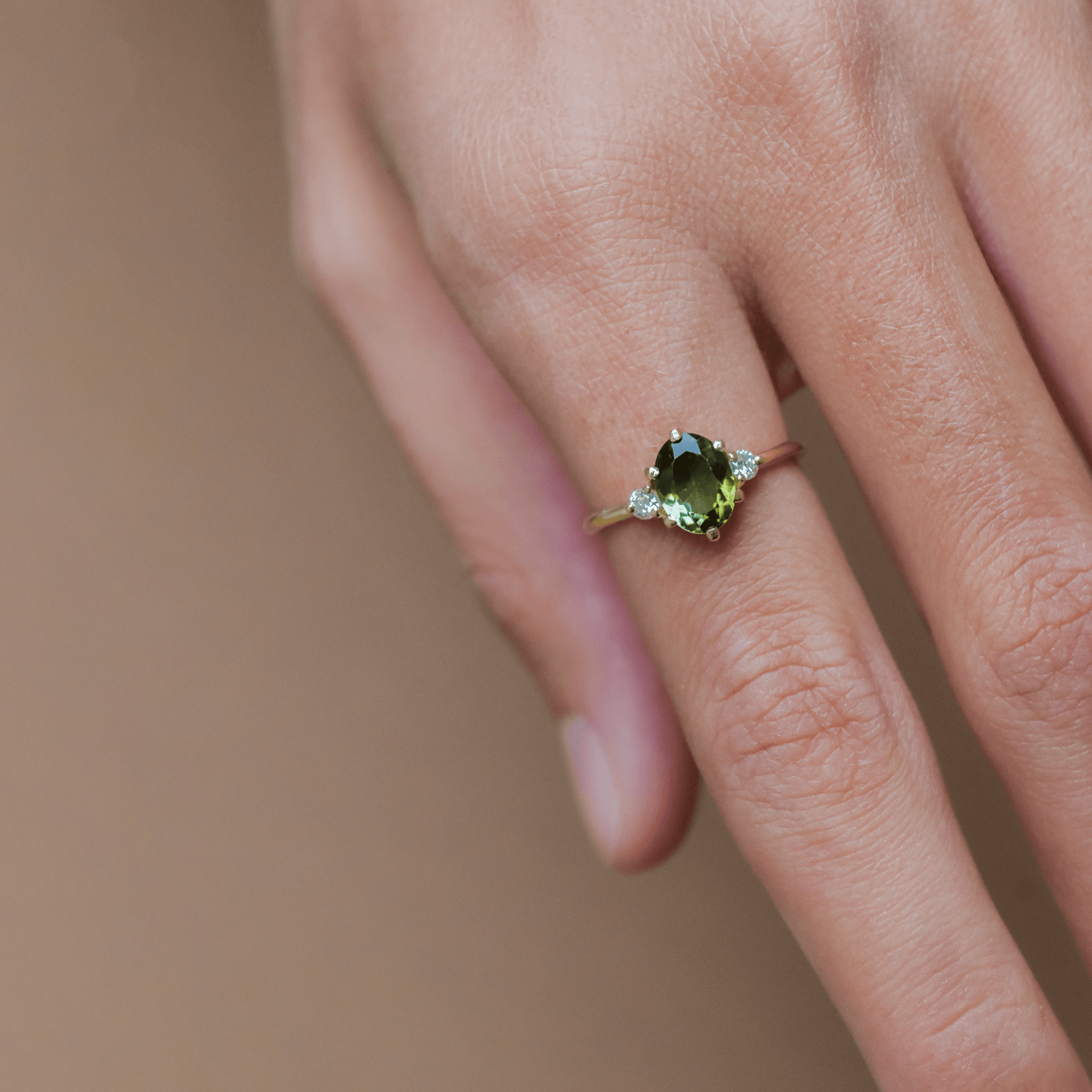 ROSA gold ring with oval purple tanzanite and diamonds