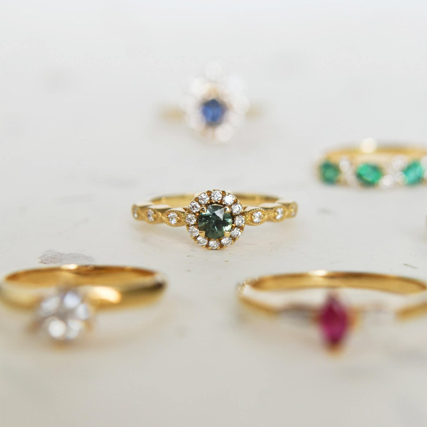 WILD MOSS gold ring with round green-navy blue sapphire and halo diamonds