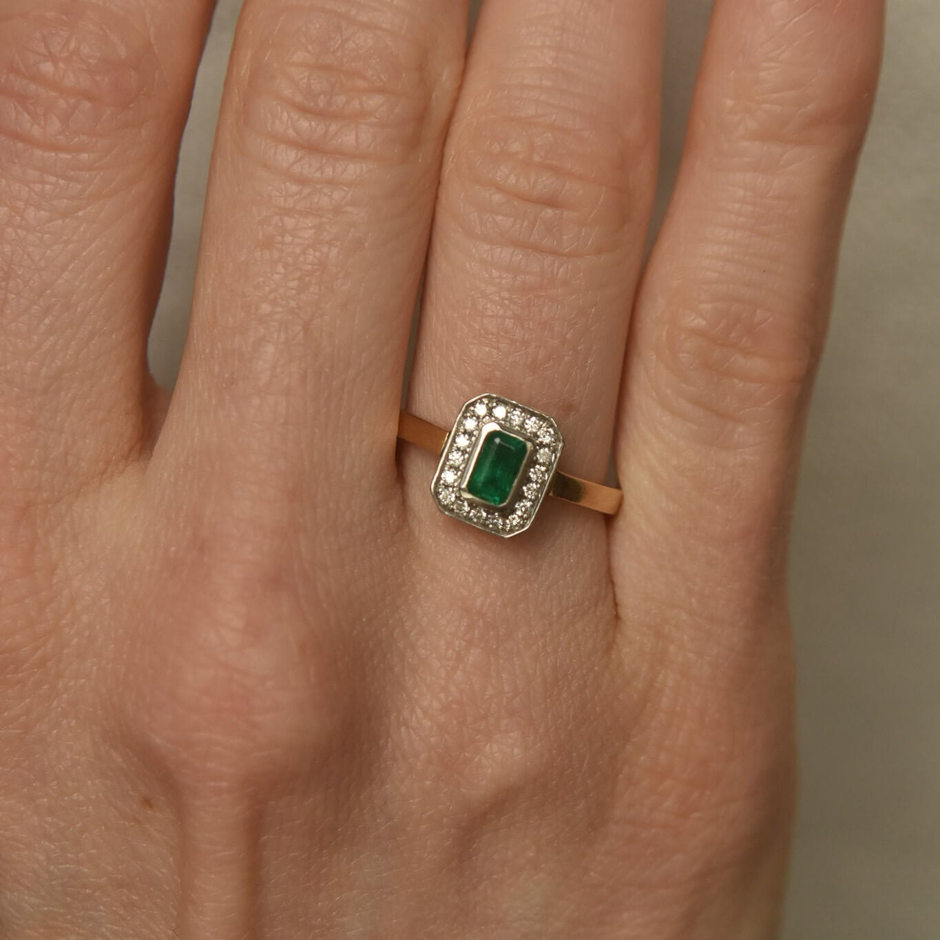 Two-Tone Gold Ring with Rectangular Emerald and Diamond Halo