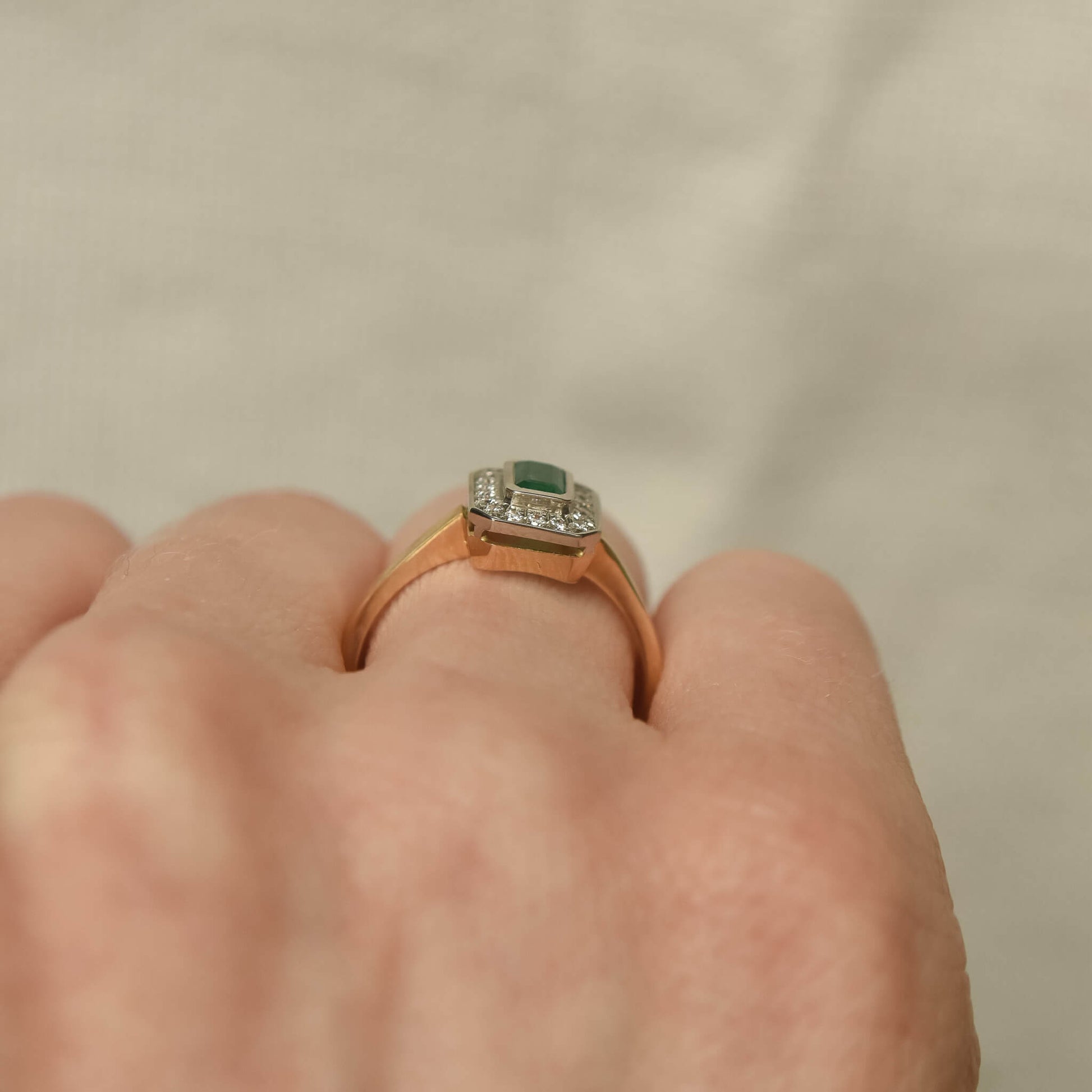 Two-Tone Gold Ring with Rectangular Emerald and Diamond Halo