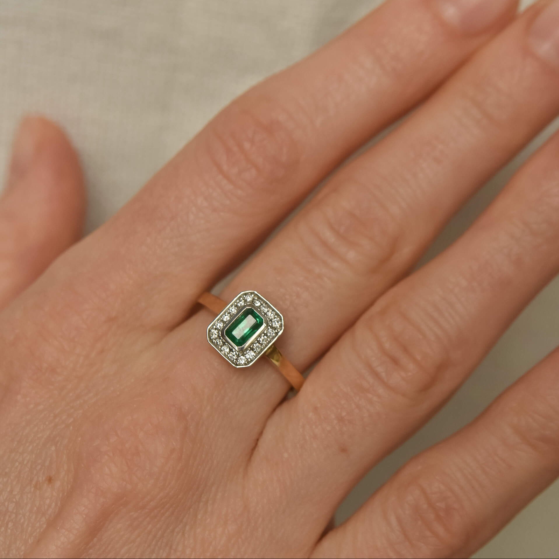 Two-Tone Gold Ring with Rectangular Emerald and Diamond Halo