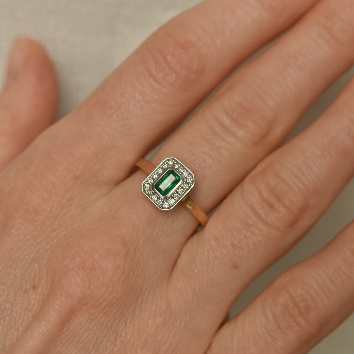 Two-Tone Gold Ring with Rectangular Emerald and Diamond Halo